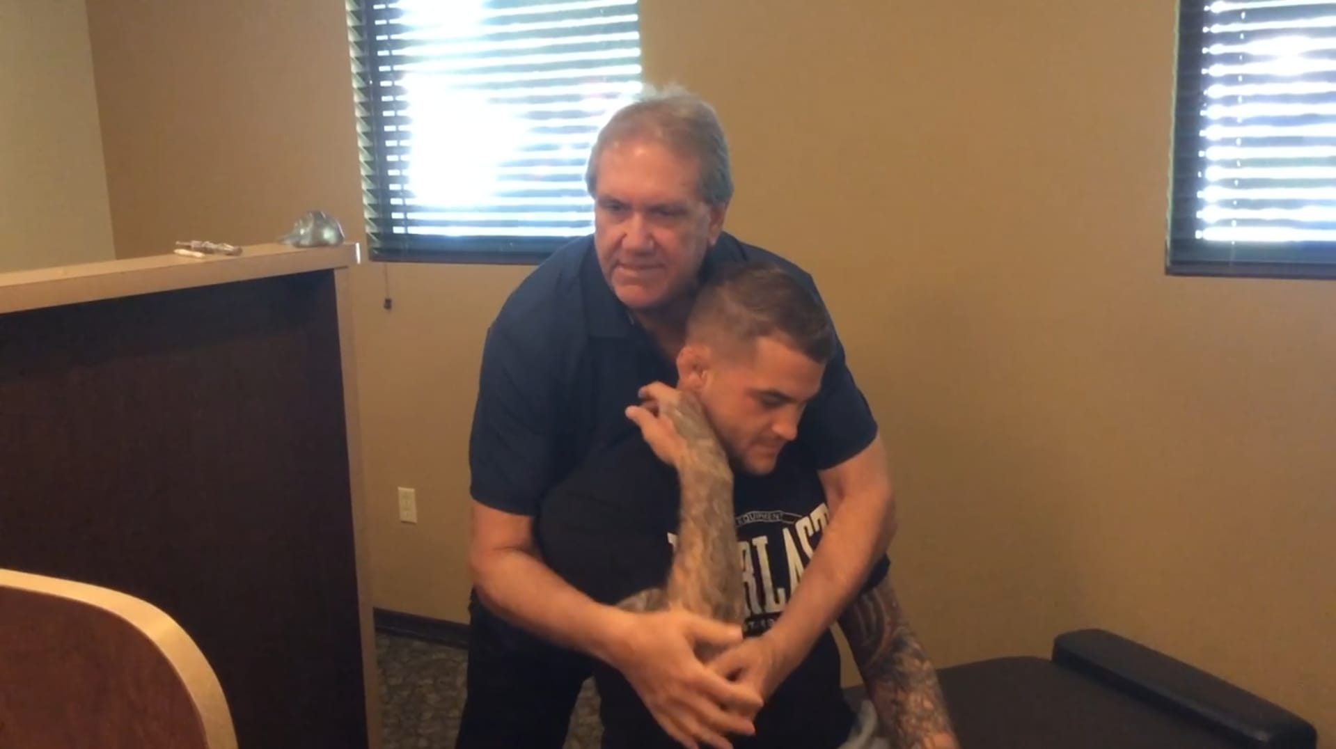 Dr. Corvin assessing shoulder mobility and thoracic spine function at Windmill Health Center